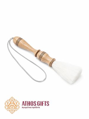 Handmade church aspergillum with a wooden handle.