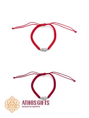 Braided bracelet with a silver icon of Saint Nicholas.
