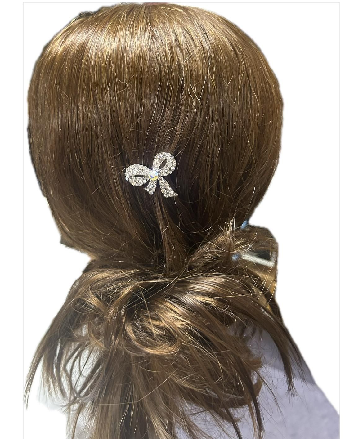 Fermaglio  con strass a forma di fiocco