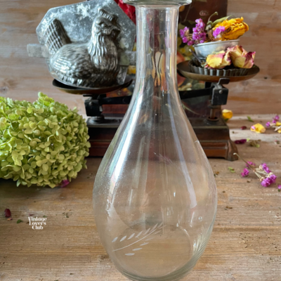 Glass bottle with wheat spike
