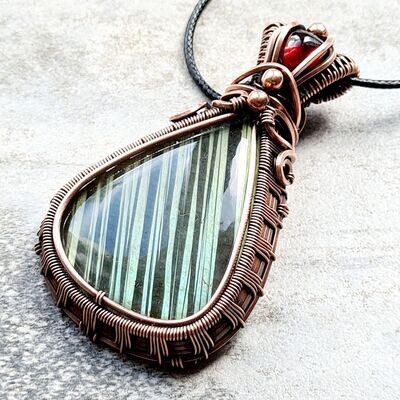 Flashy striped Labradorite with Garnet accent and beads pendant with chain.