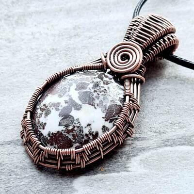 Rhyolite pendant with chain.