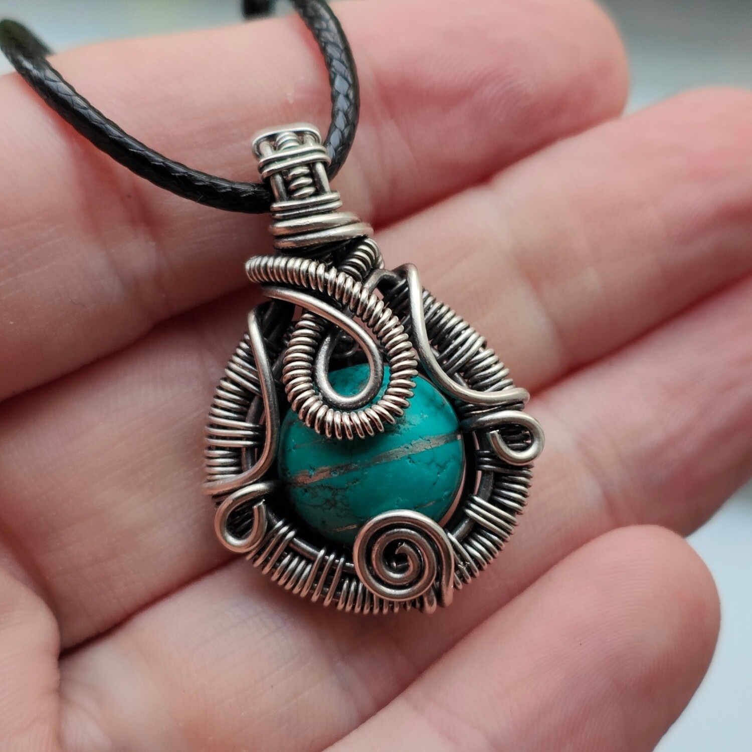 Turquoise bead in sterling silver with necklace.