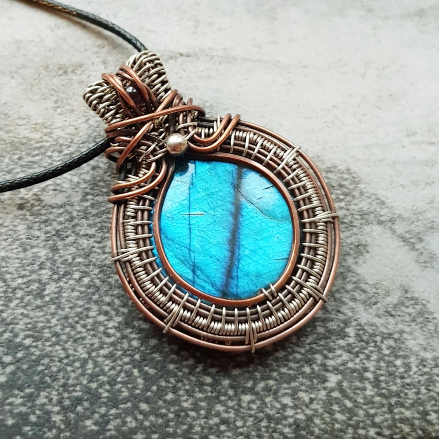 Flashy Blue Labradorite with garnet accent (cooper and silver mix) pendant with chain.