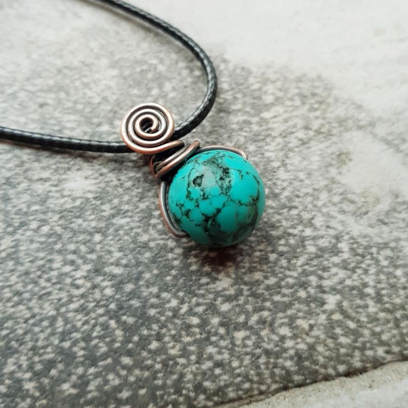 Turquoise bead pendant with chain.