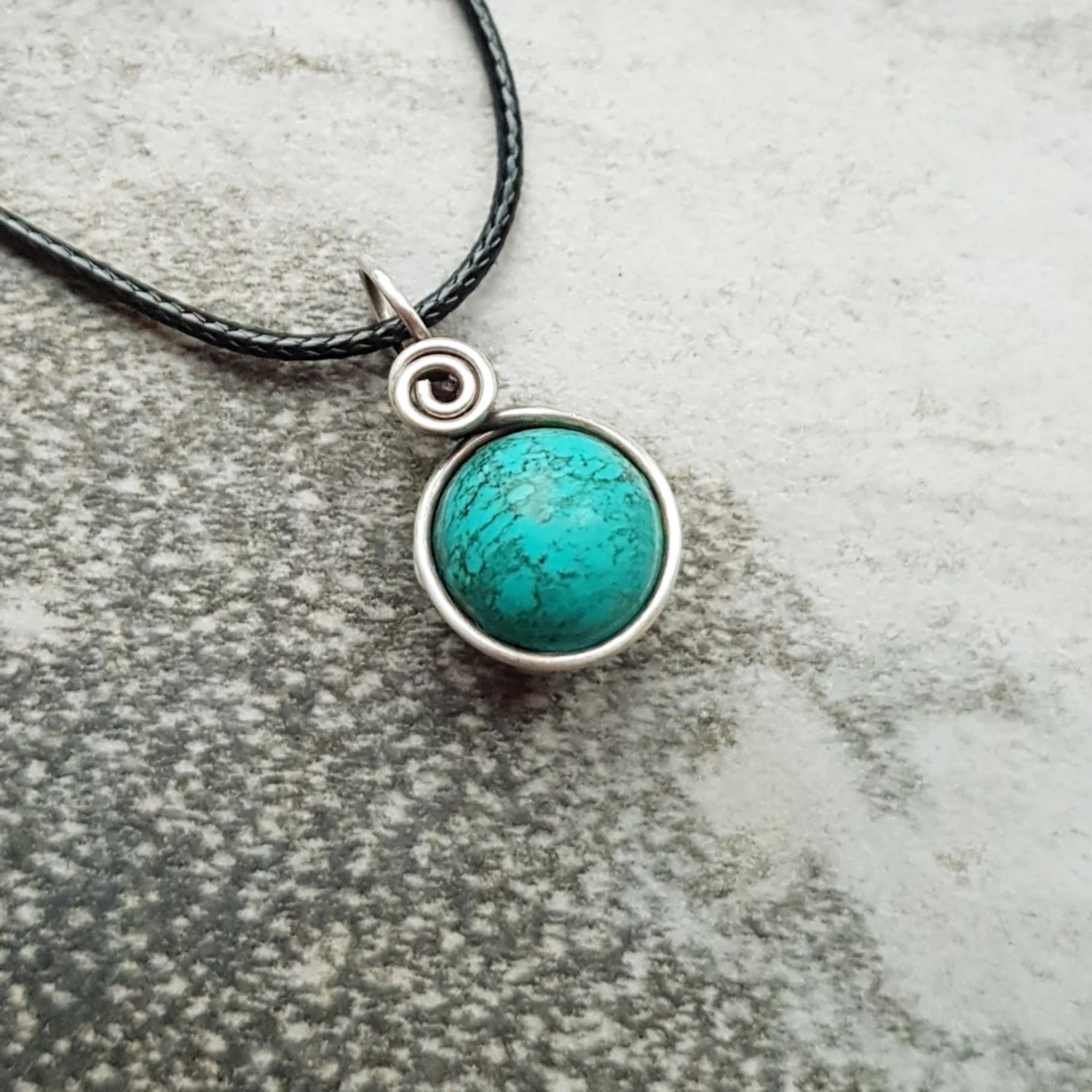 Turquoise bead pendant with chain.