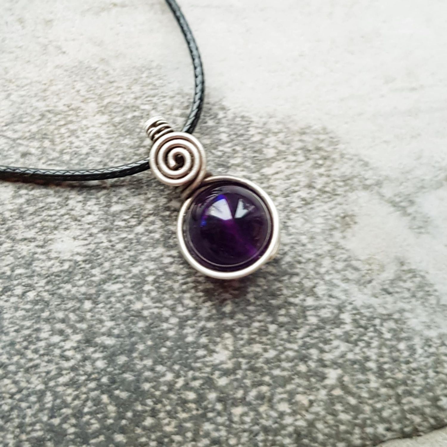 Amethyst bead pendant with chain.