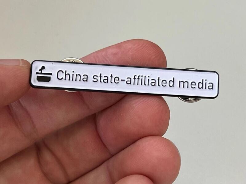 &#39;China state-affiliated media&#39; metal pin