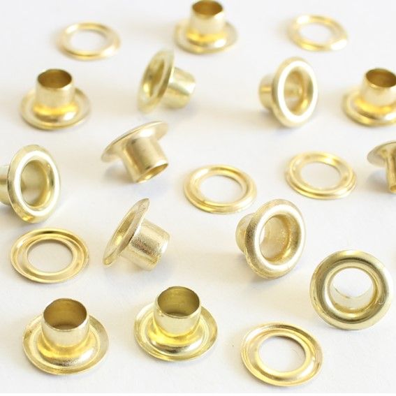 Eyelets dorados con arandelas 50 pct