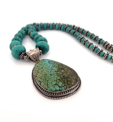 Turquoise & Sterling Silver pendant on Strand