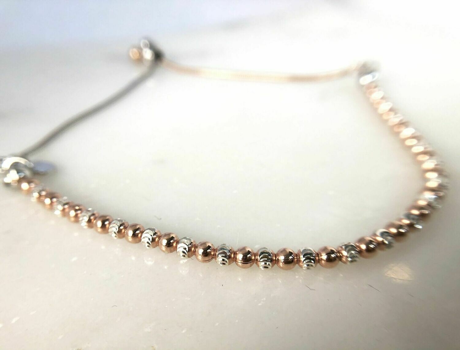 CG SS-3624 Sterling Silver/Rose Gold Plated D/C Bead Bola Bracelet