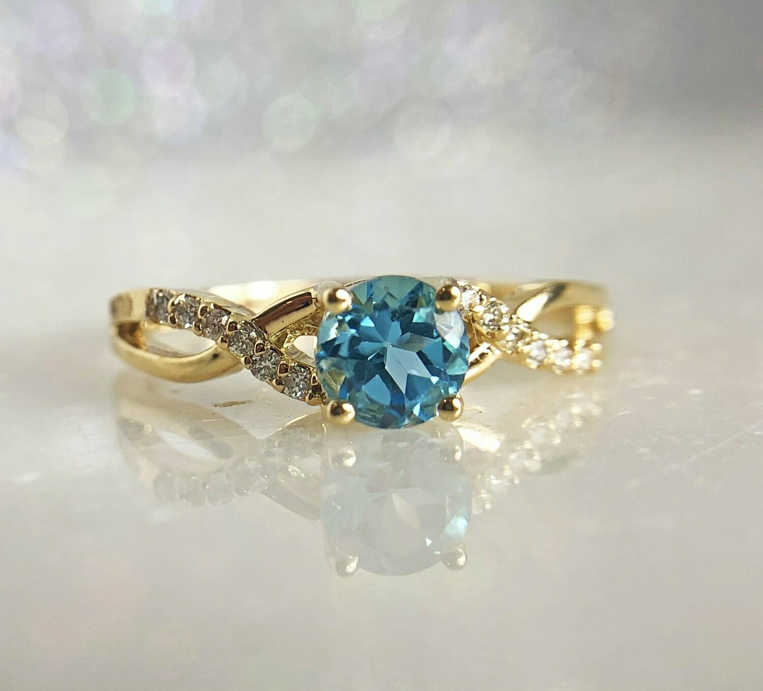 Grandeur R3552BT  14k Yellow Gold Blue Topaz & Diamond Twist Style Ring Grandeur R3552BT  14k Yellow Gold Blue Topaz & Diamond Twist Style Ring