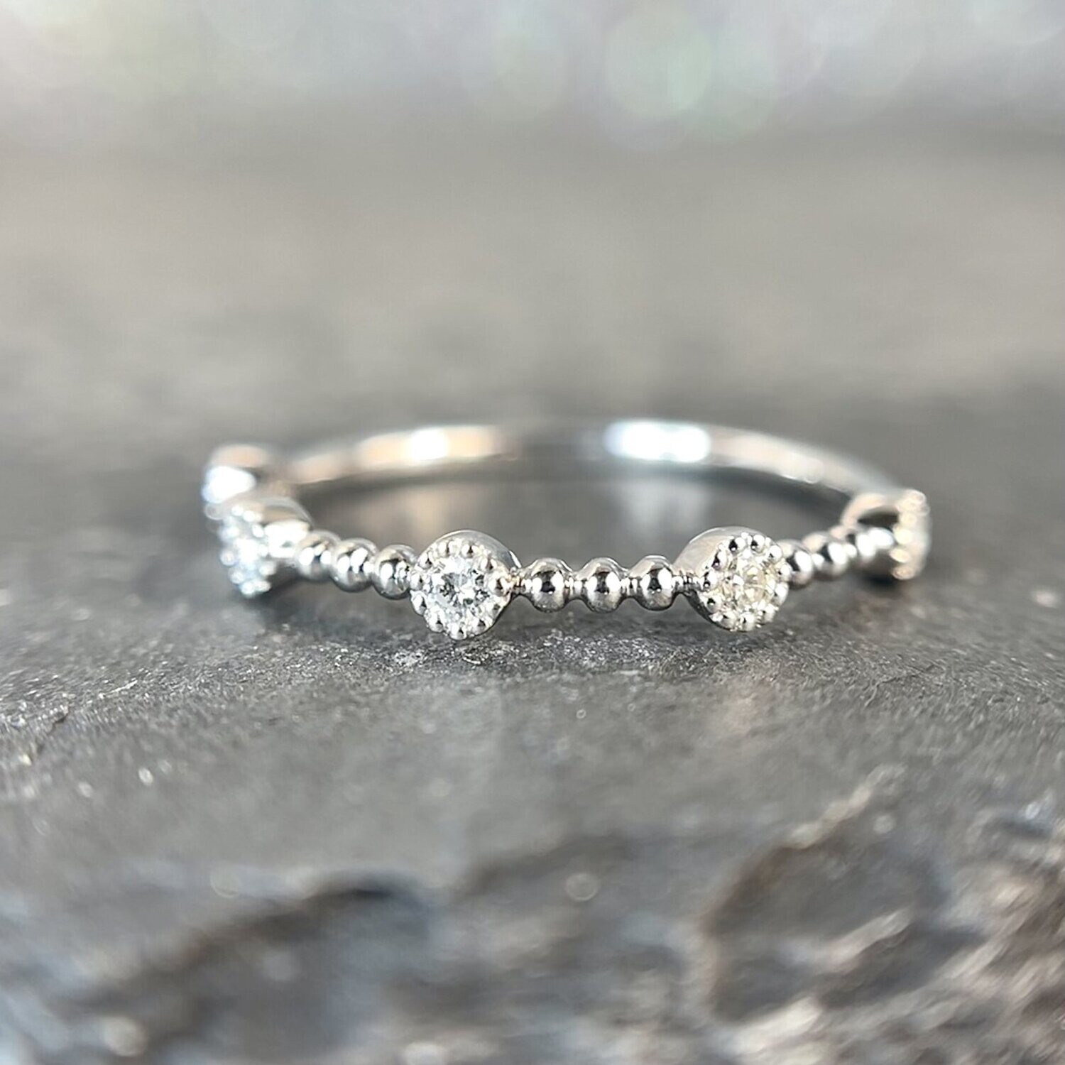24819328  14k White Gold .11ct total weight Diamond Band