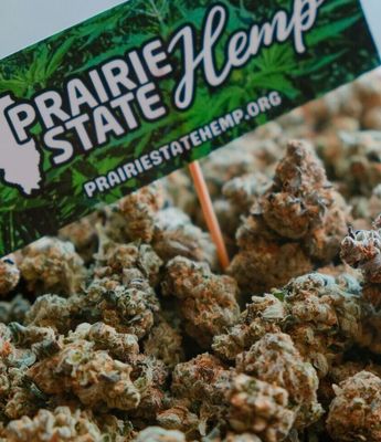 "Prairie State Hemp THC flower in bulk, with several ounces of premium, frosty buds displayed, offering high-quality cannabis at great value for wholesale or large-scale purchases."