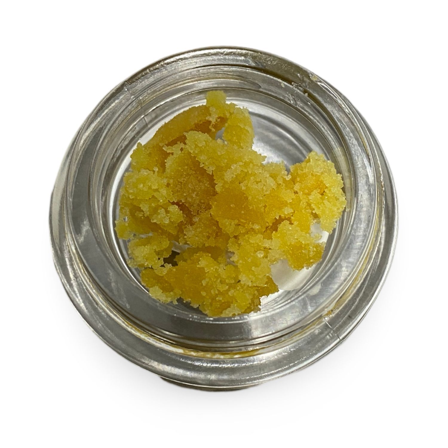 Glass jar of Clementine Crumble concentrate with bright orange crumble texture