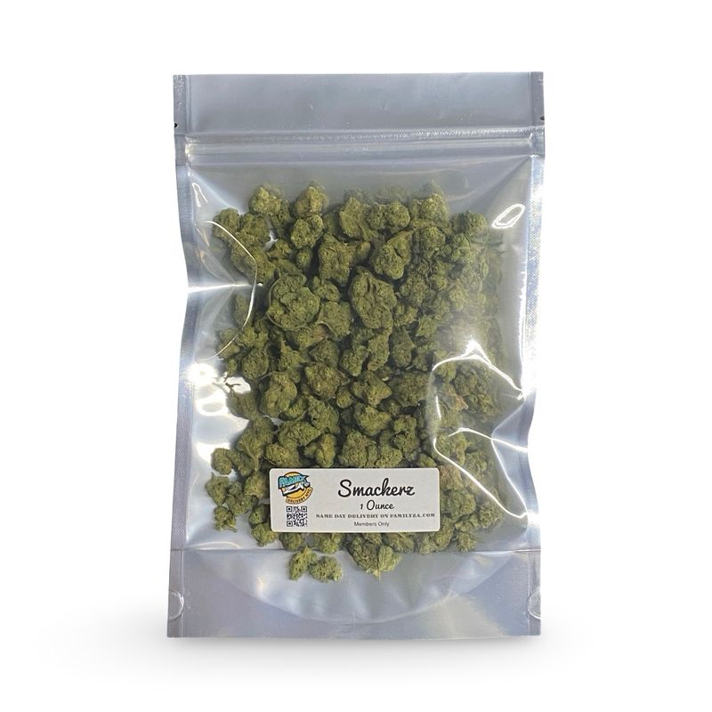 Clear resealable bag filled with small cannabis buds labeled “Smackerz – 1 Ounce” with Family Za branding and a QR code on th