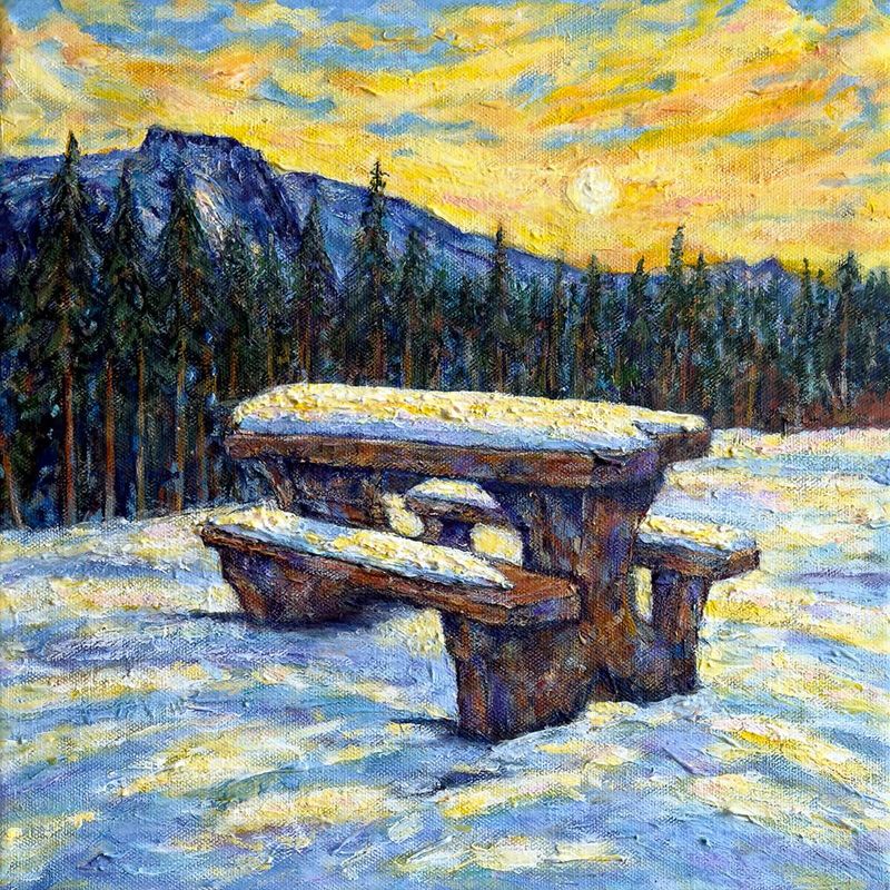 Welcome to Alberta by artist Anthony Carey, a limited-edition winter landscape print with picnic table beneath the mountains