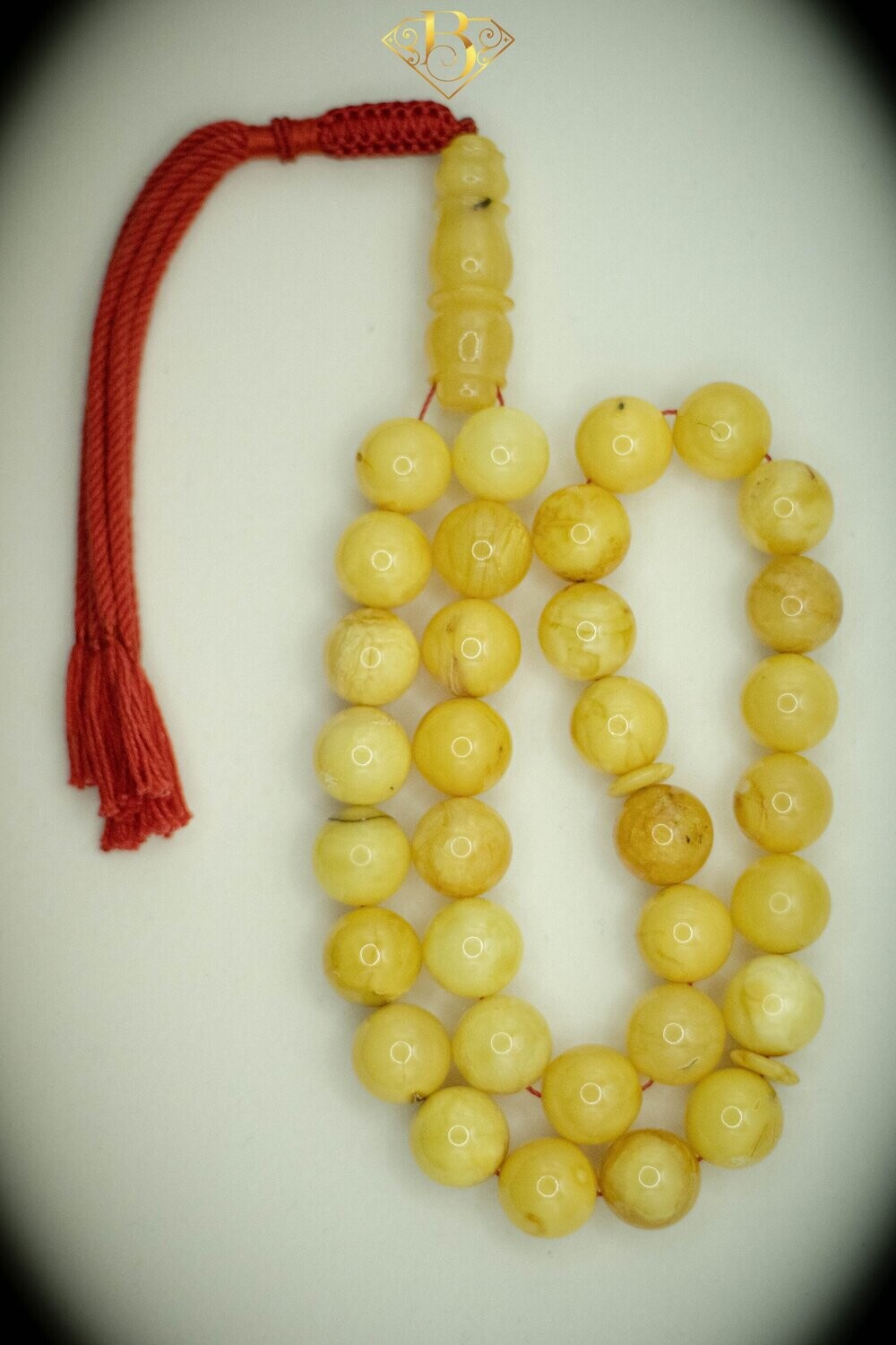 Yellow Round Shape Red Tassel
