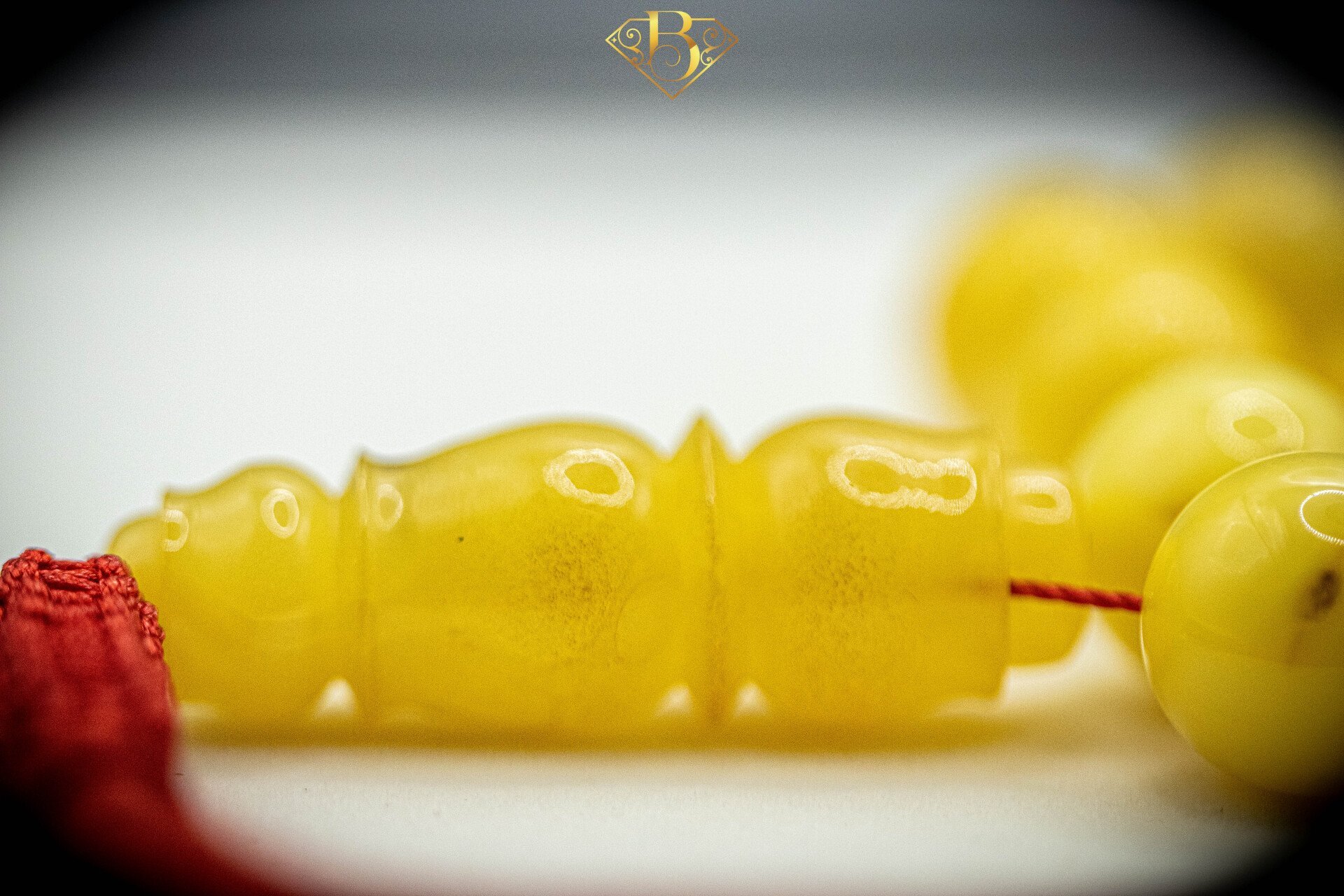 Yellow Round Shape Red Tassel