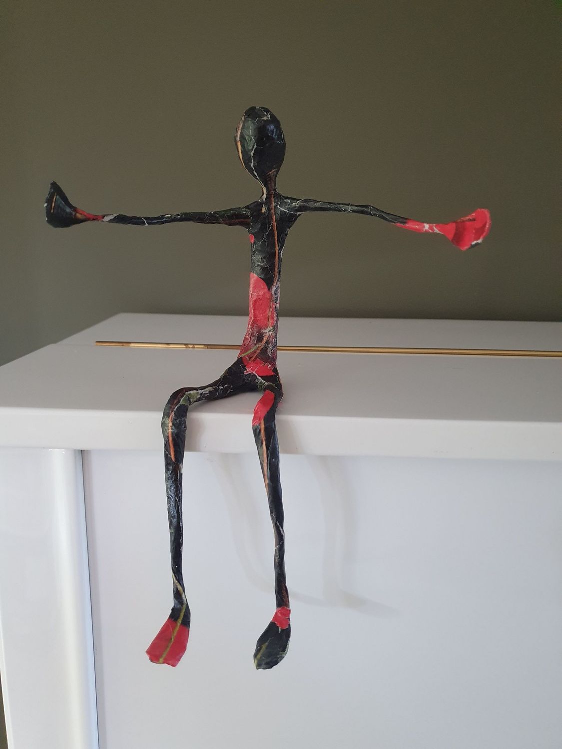 Troostmannetje klein, zwart en rood Troostmannetje klein, zwart en rood