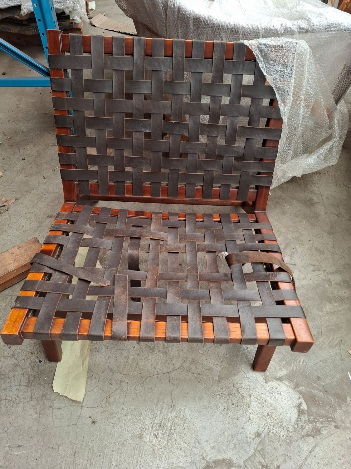 X Not for sale leather strap and wood chair