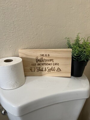 This is a Bathroom Wood Sign
