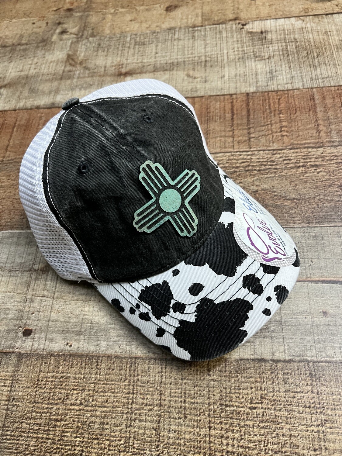 Teal Zia on Cow Print Ponytail Hat 