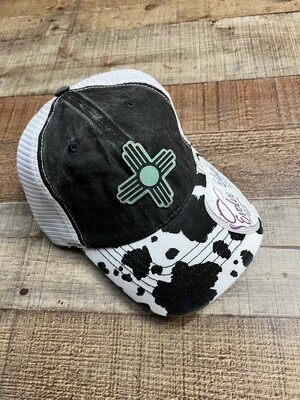 Teal Zia on Cow Print Ponytail Hat