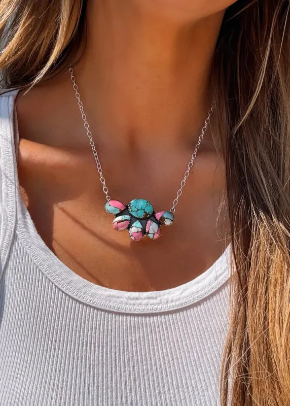 A cotton candy swirl of turquoise magic - this pendant pops with pink-blue beauty.
