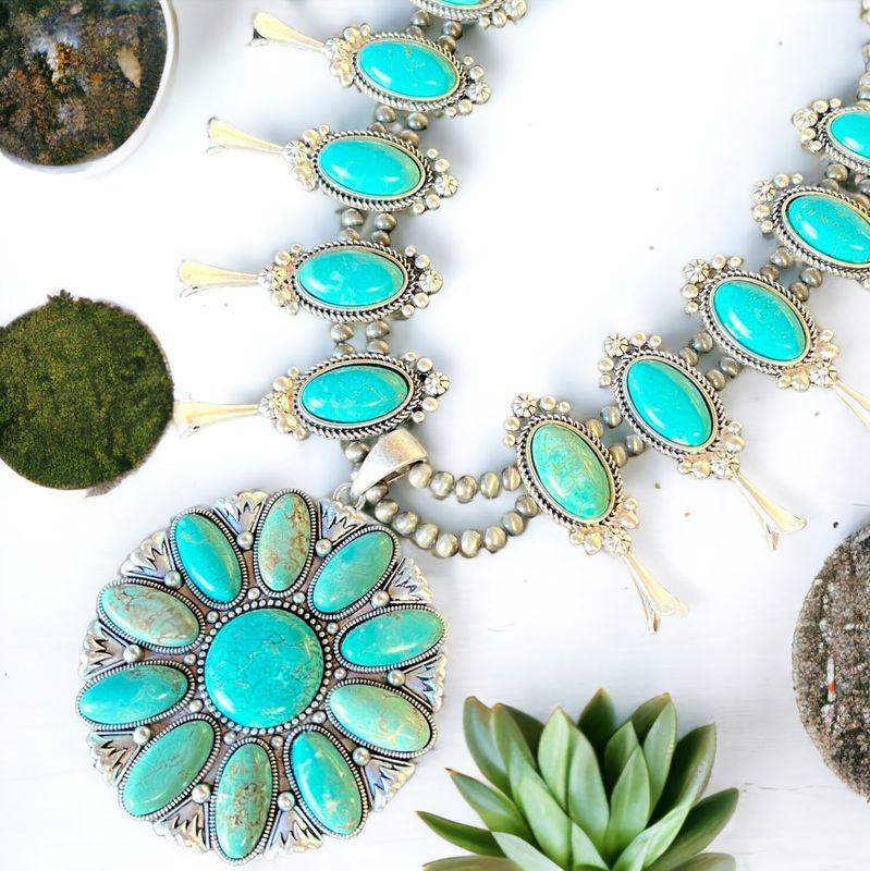 Stunning squash blossom turquoise necklace with vibrant stones and Western flair.  A bold statement piece for any outfit.