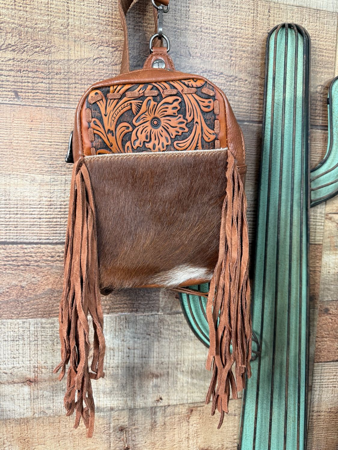 Trinity Ranch Tooled Cowhide Sling Bag with Fringe