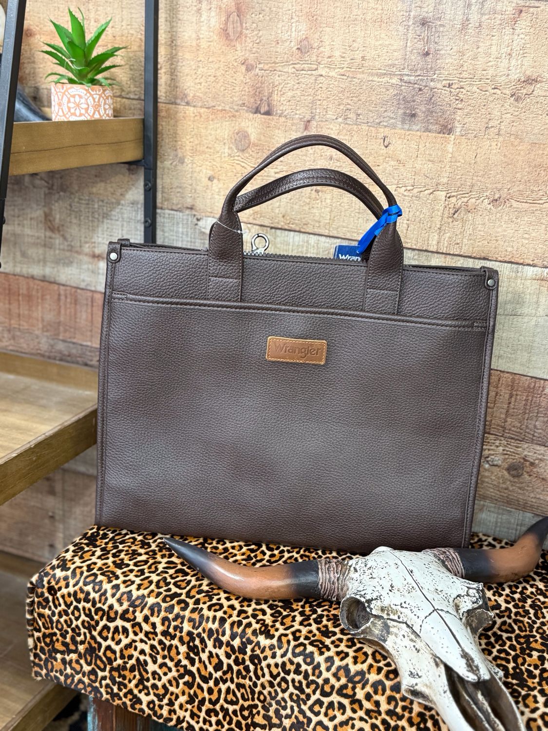 Wrangler Carry-All Large Tote Work Tote/Crossbody Inside of the bag includes a padded compartment for your electronics, roomy