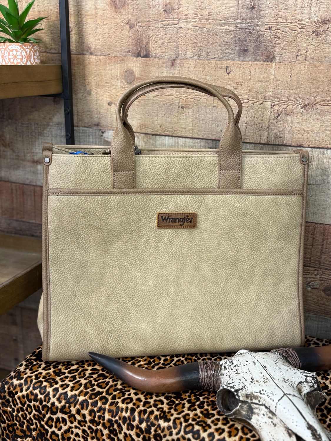 Wrangler Carry-All Large Tote Work Tote/Crossbody Inside of the bag includes a padded compartment for your electronics, roomy