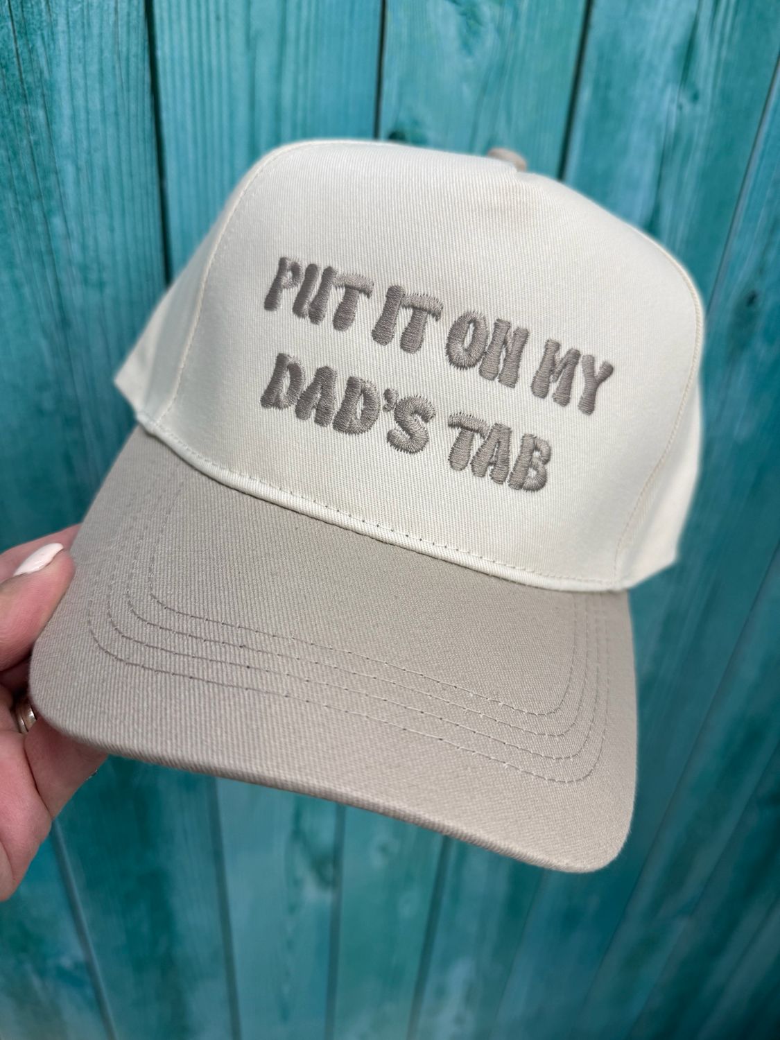 Put It On My Dad’s Tab Tan Embroidered Trucker Hat