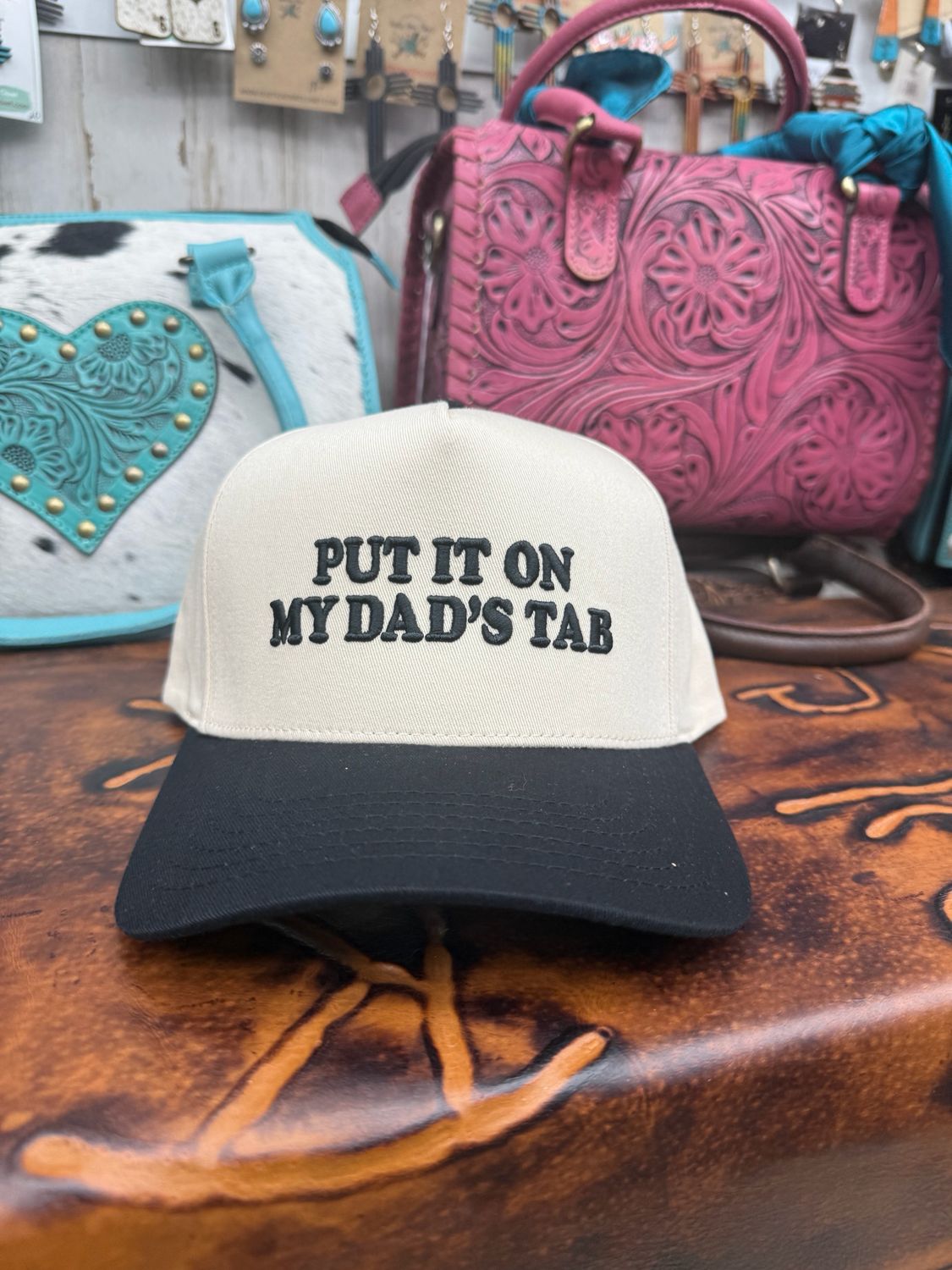 Put It On My Dad’s Tab Embroidered Trucker Hat