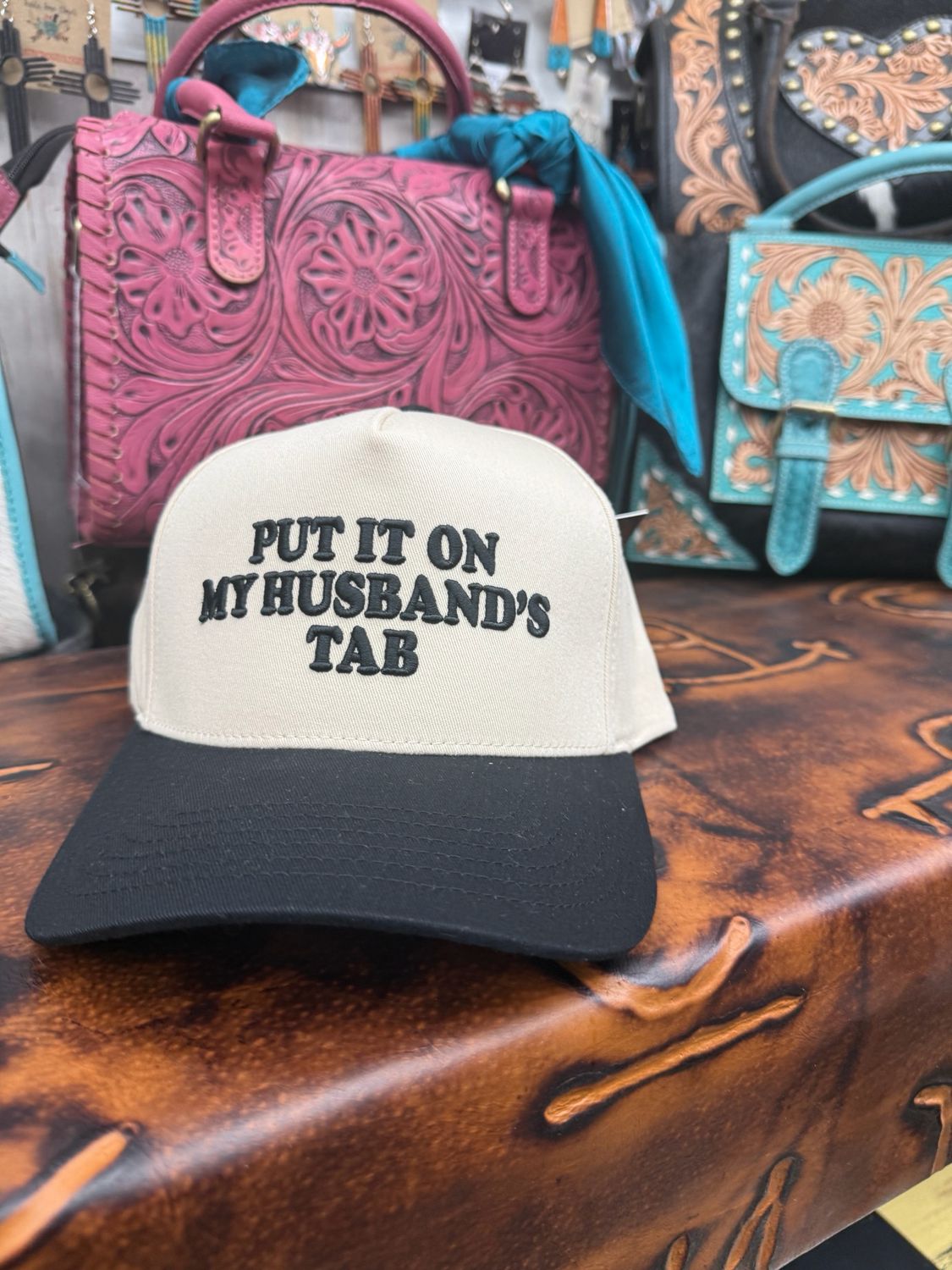 Put It On My Husband’s Tab Black Embroidered Trucker Hat