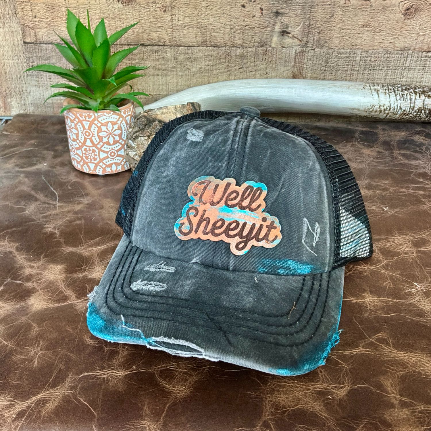 Well Sheeyit Painted Black Criss Cross Ponytail Hat