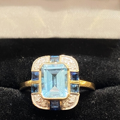 Blue Topaz Set With Sapphire And Diamond Surround