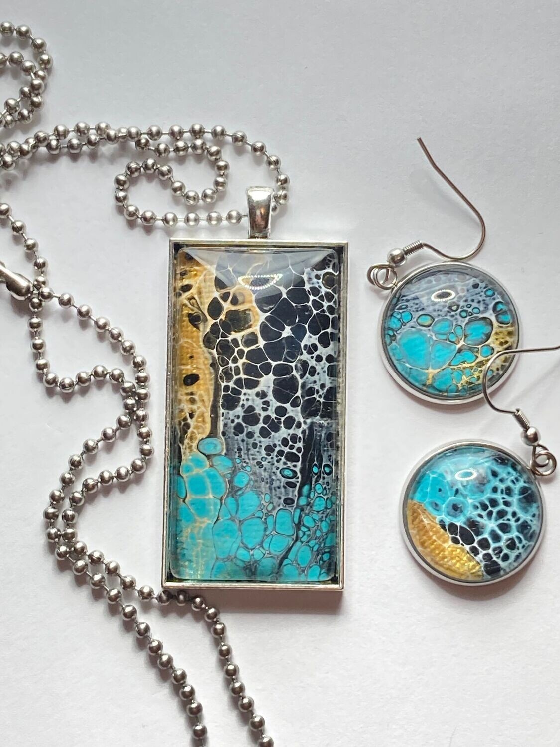 One of a kind paint pour wearable art necklace and earring set