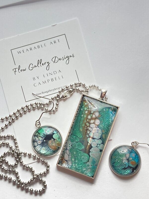 Stunning wearable art paint pour design necklace and earring set