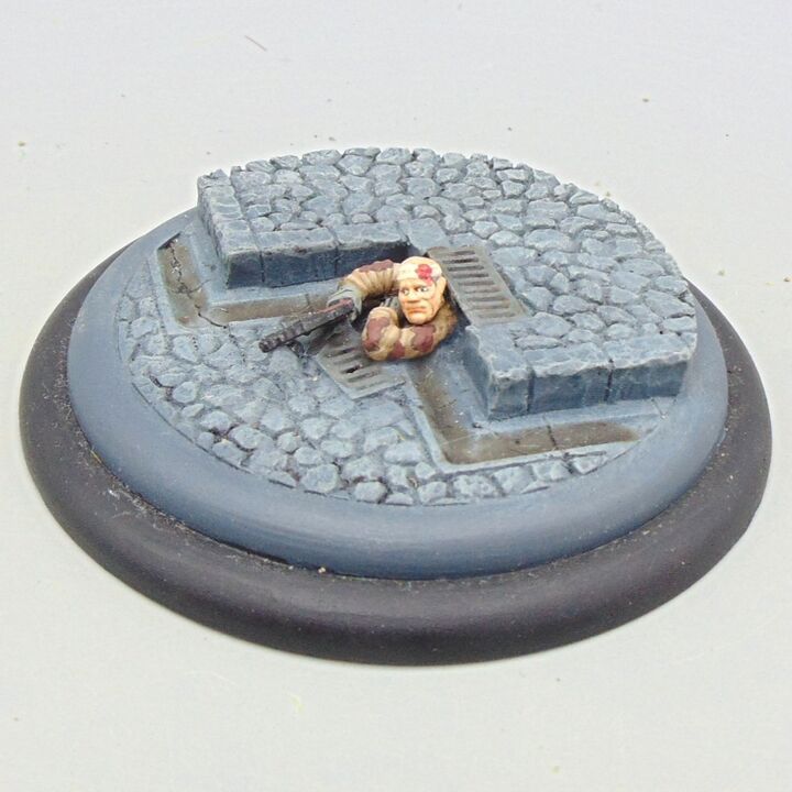 Grade B - Unidentified Manufacturer - WW2, Eastern Front - Soviet Scout Hiding in Street Drain Vignette Grade B - Unidentified Manufacturer - WW2, Eastern Front - Soviet Scout Hiding in Street Drain Vignette