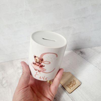 Money box. Teddy initial Pink