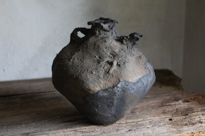 Wabi-sabi ceramic vase like a jug, of wild clay