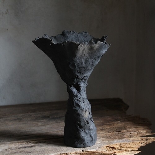 Wild clay ceramic design vase, flower-like sculpture.