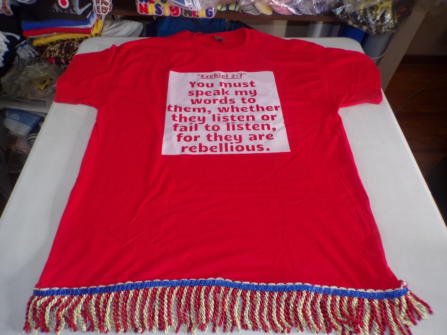 You Must Speak My Words unto Them, whether they will listen or fail to listen, for they are rebellious. Red Tee Red/Gold Fringes Ezekiel 2:7