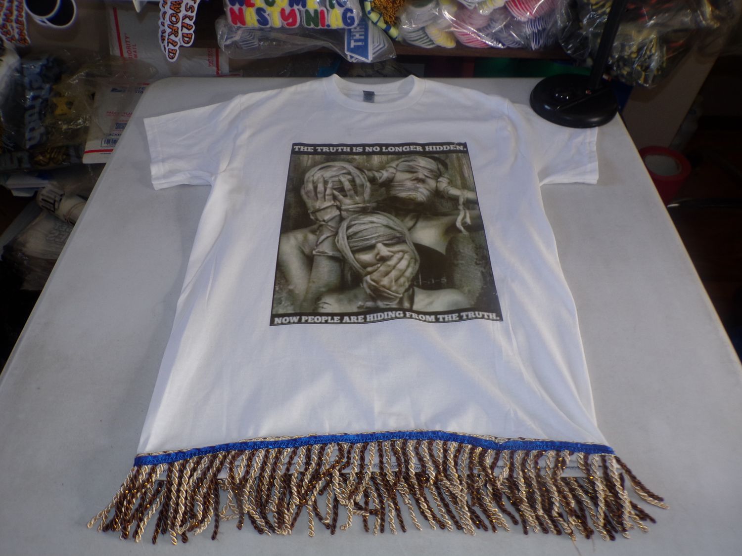 The Truth Is No Longer Hidden Now People Are Hiding from The Truth White Tee Brown/Gold Fringes