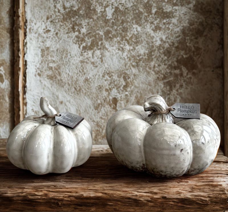 Set of two ceramic pumpkins with a glossy, reactive glaze in shades of grey. Small wooden tag engraved Hello Pumpkin attached