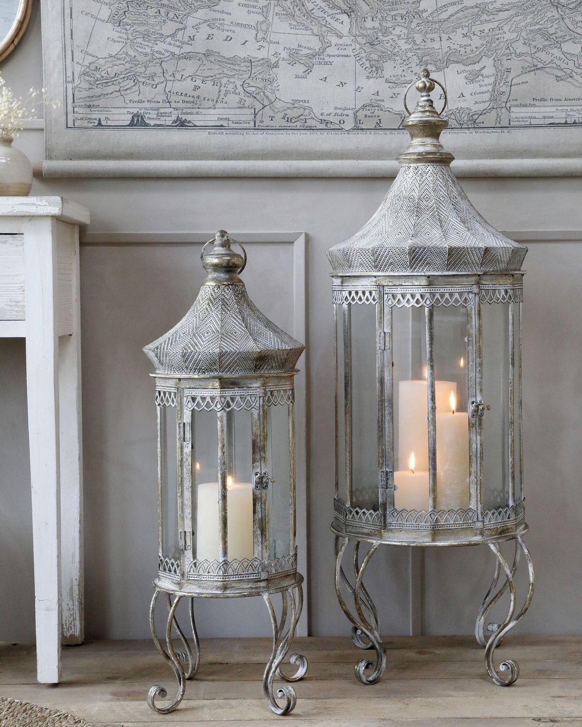 Antique Champagne Vire Lantern Stately home vibes exude from these stunning Vire Lanterns with flickering candles and arranged against a panelled grey wall