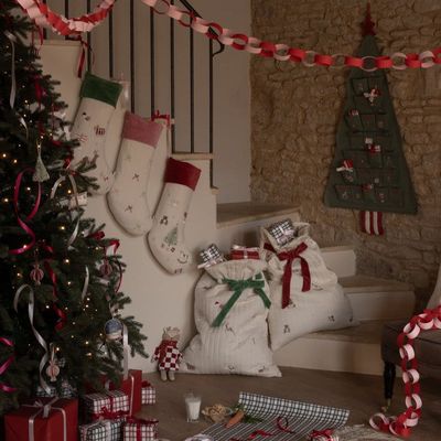 Plush Christmas display of festive stockings in several designs that coordinate perfectly with our Christmas Present Sacks