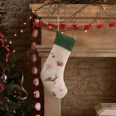 Christmas Stocking - The North Pole The North Pole Stocking hung on the mantle waiting for Santa. Embroidered with gorgeous Christmas scenes & plush green trim